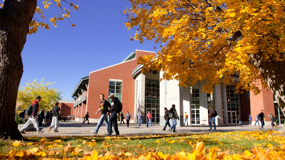 The Idaho Student Union Building at midday, bustling with students.