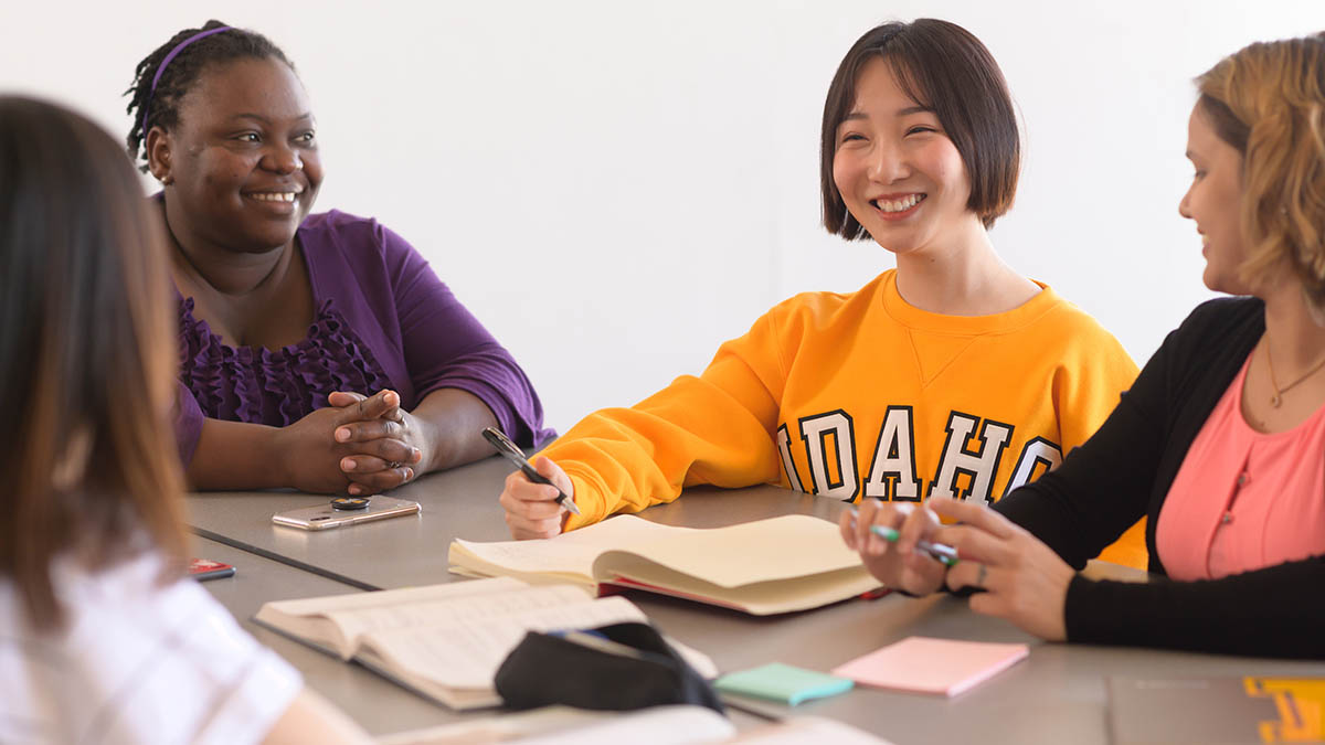 Four international students in a classroom