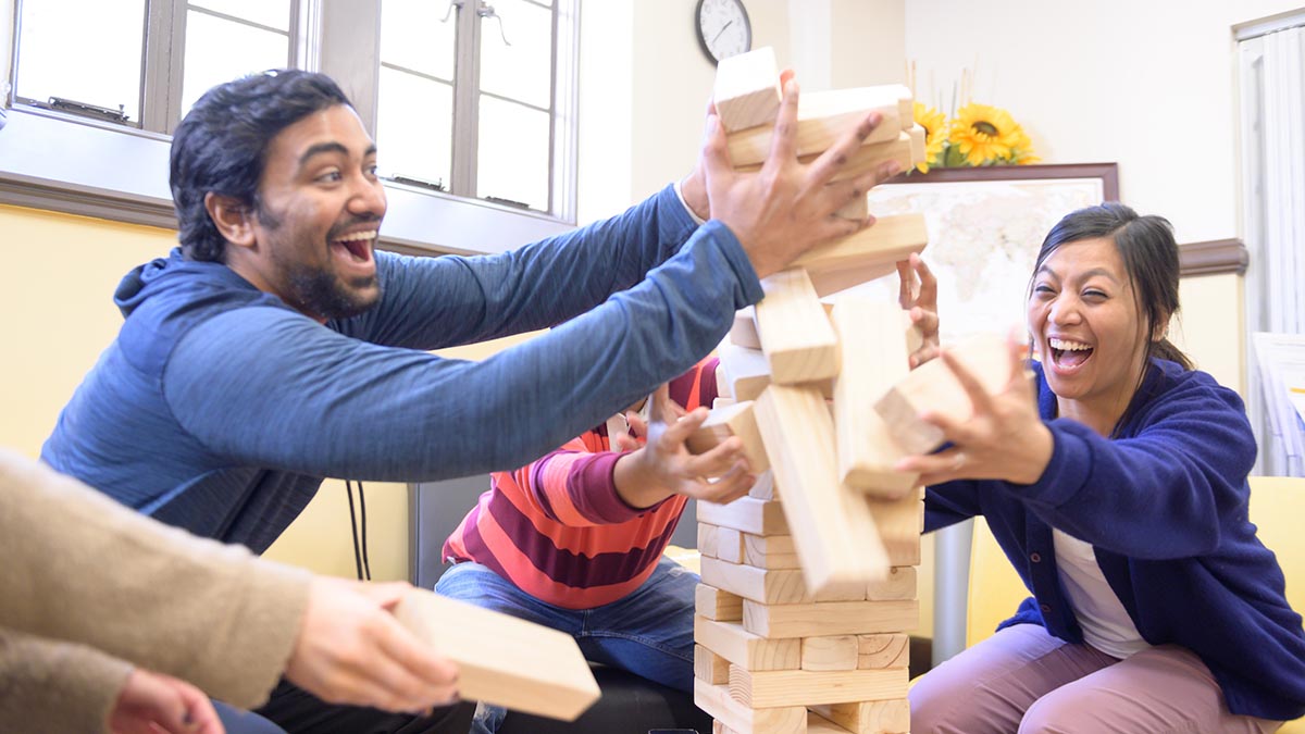 International students play Jenga in the GSSP lounge