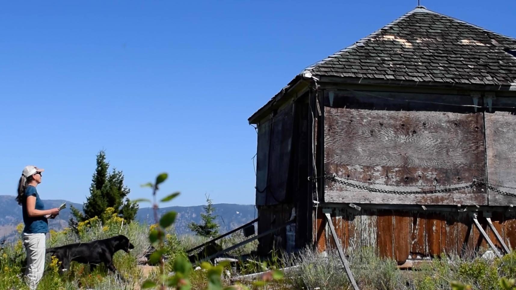 Teresa Cohn walks toward an old structure in the Frank Church Wilderness.