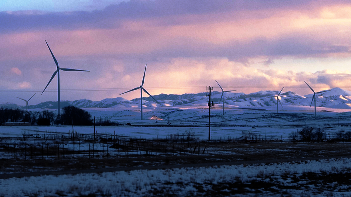 Windmills in front of sunset