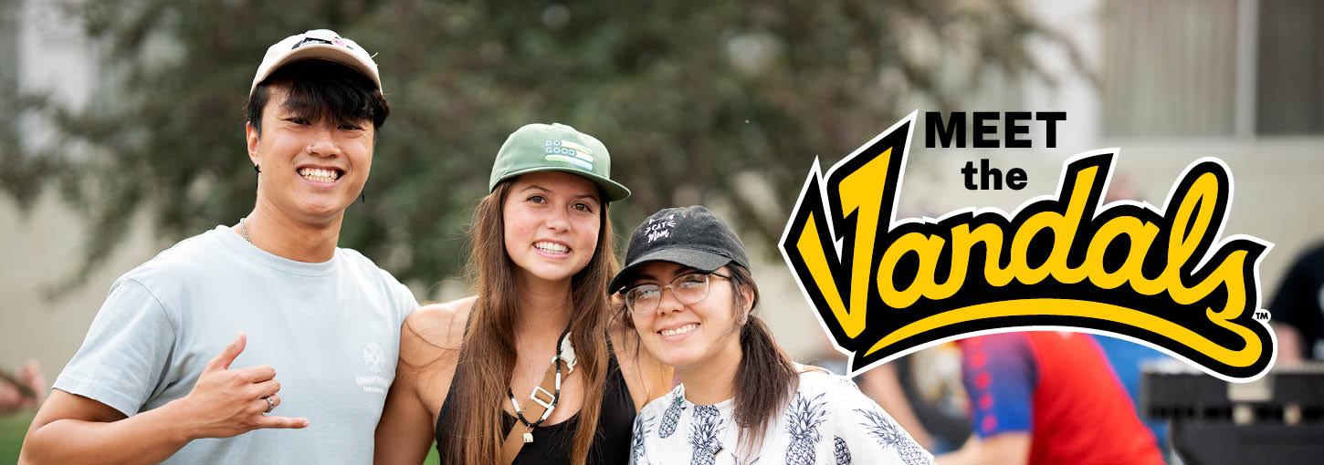 Three U of I students smiling at the camera