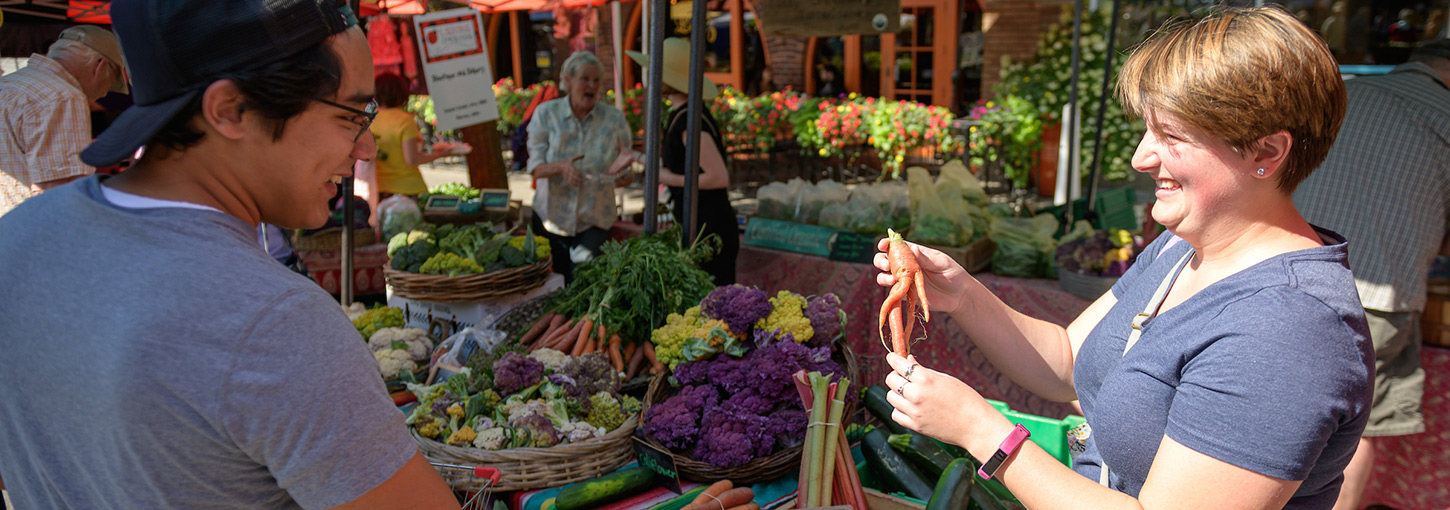 Shoppers peruse a produce stand at Moscow's Farmers' Market